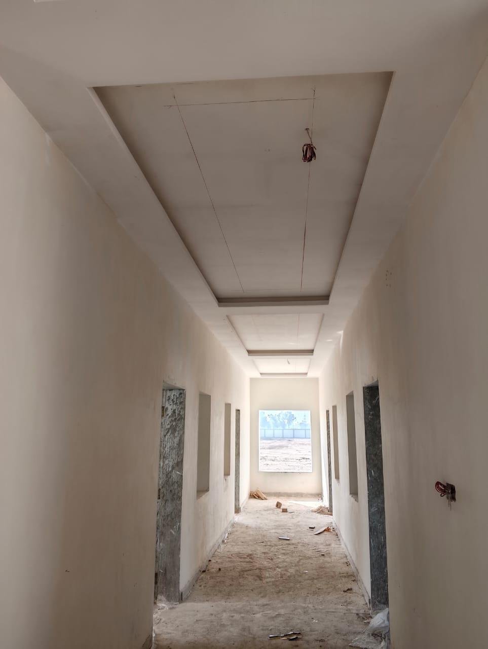 Ceiling and interior finishing works in progress at the Lalian colony.