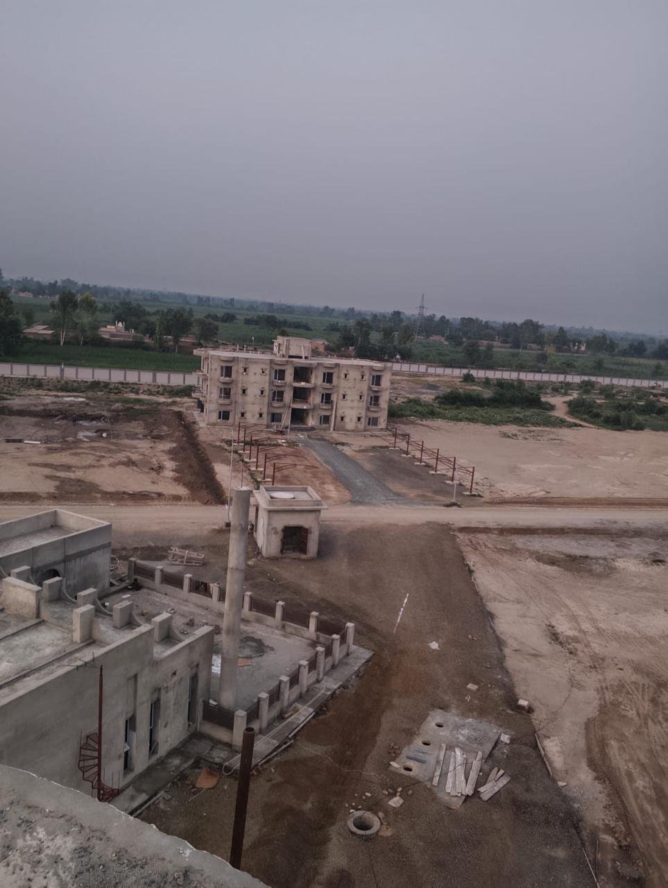 Elevated view of residential blocks and internal road development.